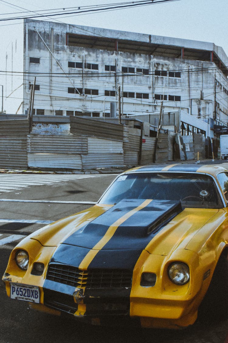 Yellow Retro Car On City Street