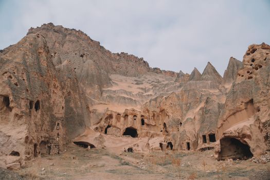 Explore ancient rock formations in Cappadocia, showcasing stunning natural erosion.
