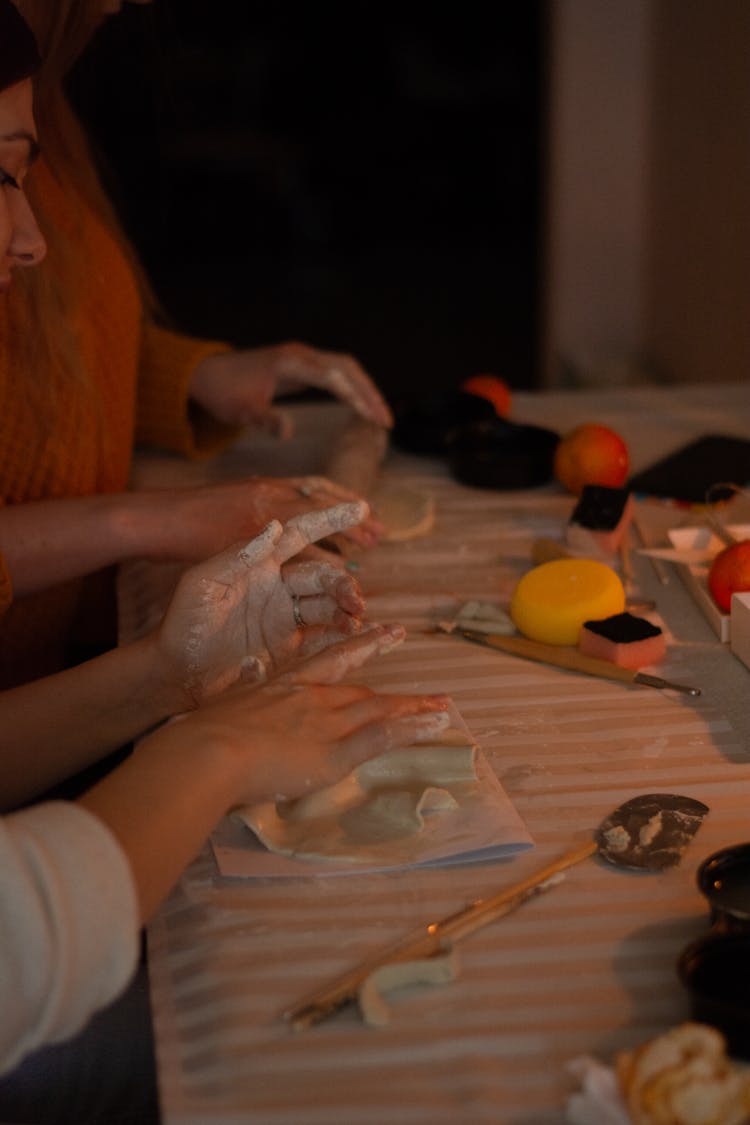 Women Shaping A Clay