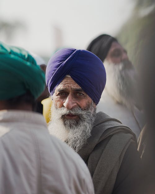 Portrait of an Elderly Man in a Turban in a Crowd 