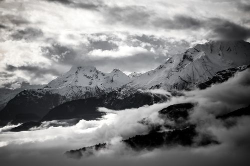 Free Stunning black and white image of snow-capped mountains in Crans-Montana, Switzerland. Stock Photo