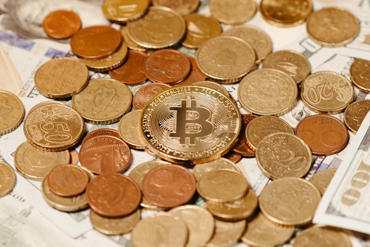 Bitcoin On Pile Of Golden Coins