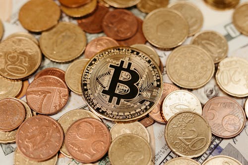 Free Bitcoin on Pile of Coins Stock Photo