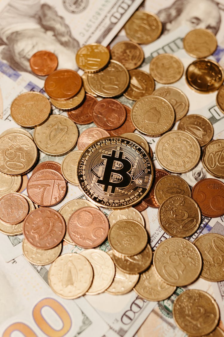 Bitcoin On Pile Of Golden Coins