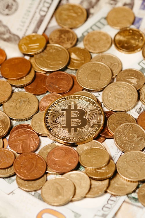 Bitcoin on Golden Coins Pile