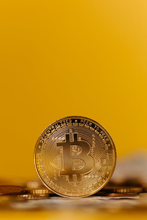 Free Bitcoin on Yellow Background Stock Photo