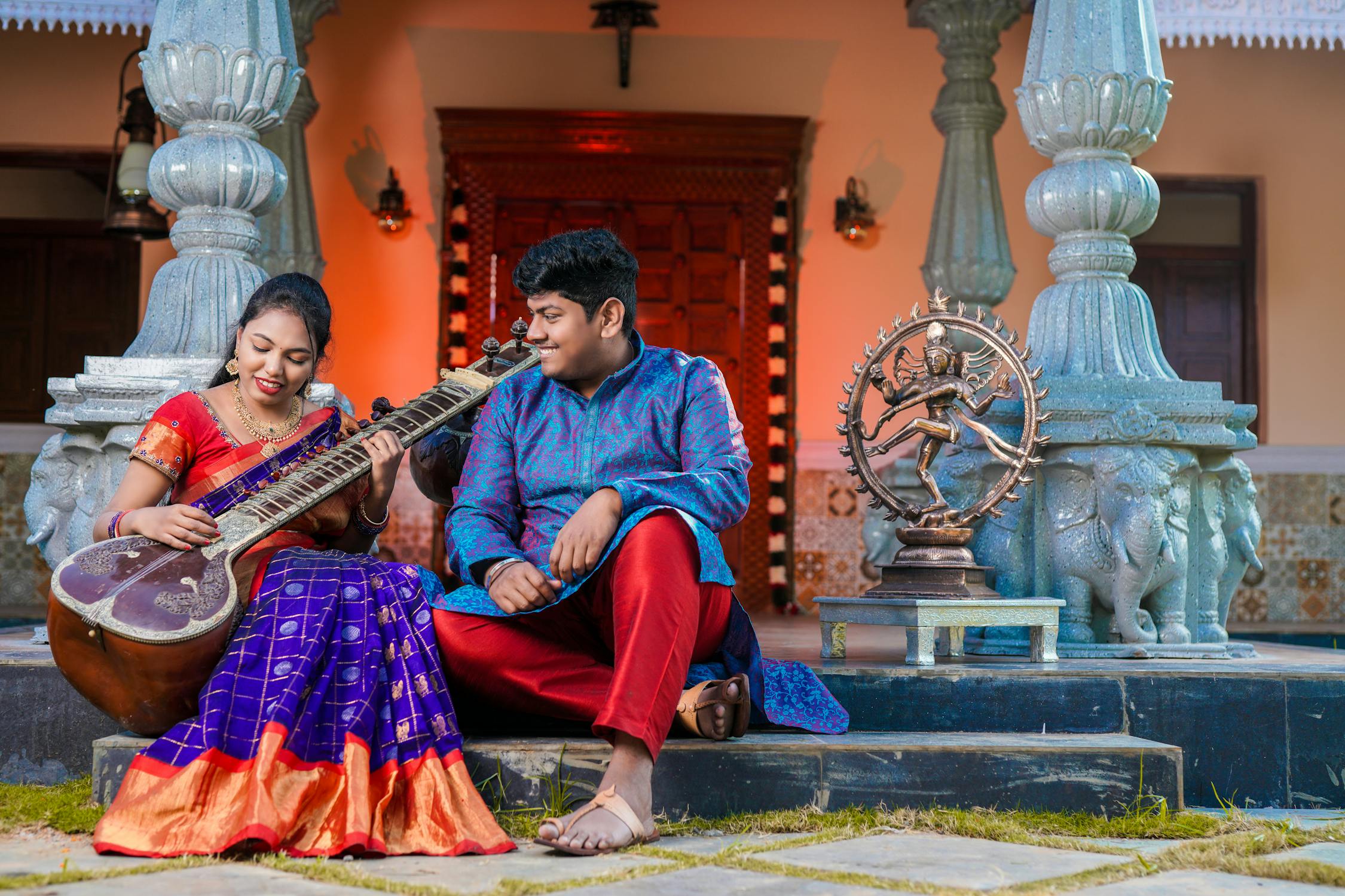 Indian Music Photo by ravi noel from Pexels: https://www.pexels.com/photo/a-woman-playing-a-musical-instrument-beside-a-man-14891905/