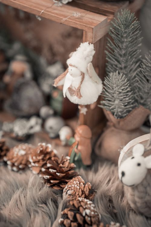 Free Warm and inviting handmade Christmas nativity scene with festive decorations and pine cones. Stock Photo