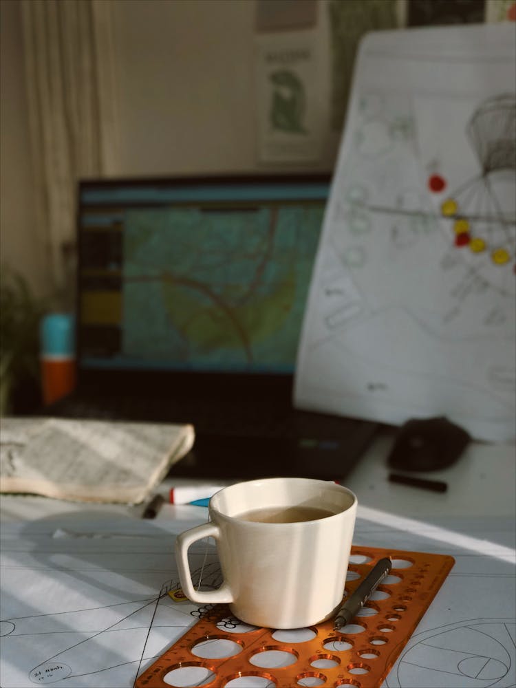 A Cup On Top Of A Measuring Tool