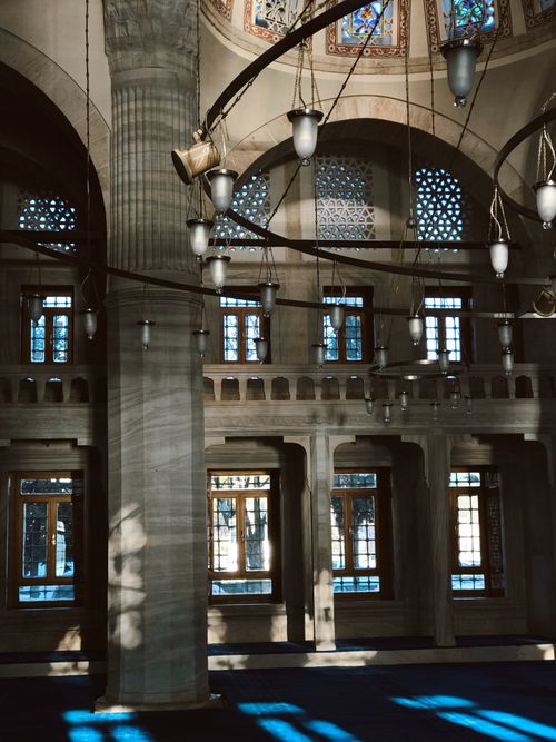 Free Elegant mosque interior with intricate architecture and beautiful lighting. Stock Photo