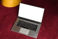 Laptop on Red Surface