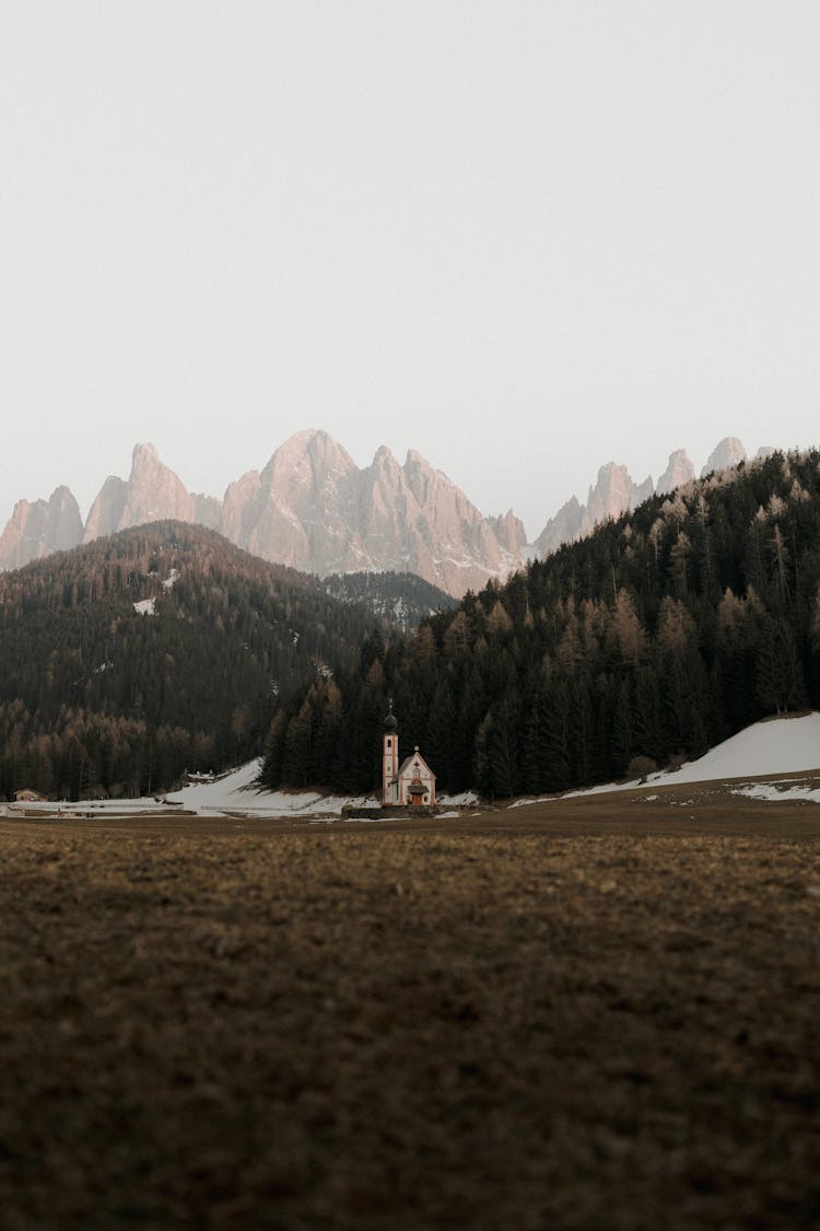 Photo Of A Mountains Landscape And A Church In The Valley