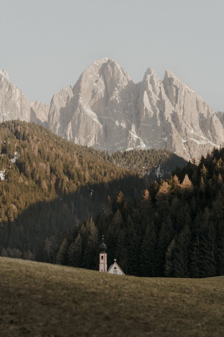 Photo Of The Mountains And A Church In The Valley