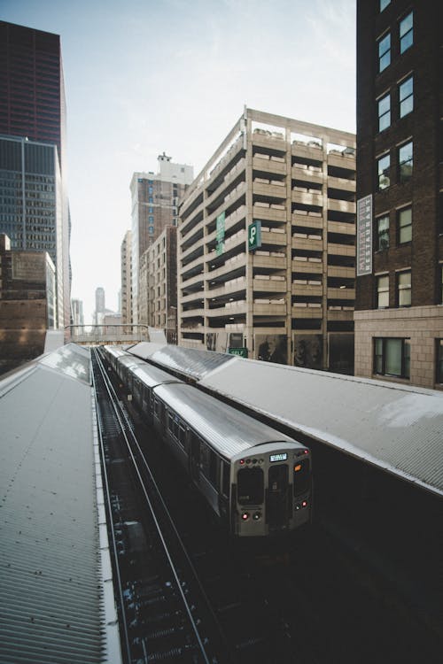 Train In Between Buildings
