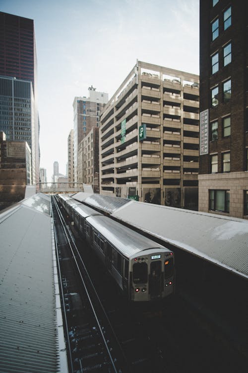 Free Train In Between Buildings Stock Photo