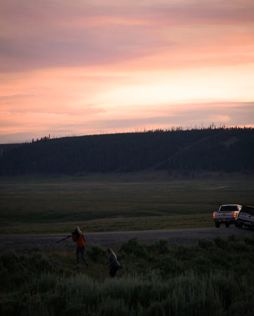 Silhouette of Mountain Near Grass Field