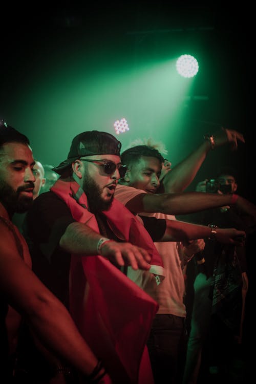 Men Dancing at Concert