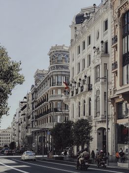 Beautiful city street featuring historic European architecture and bustling urban life.