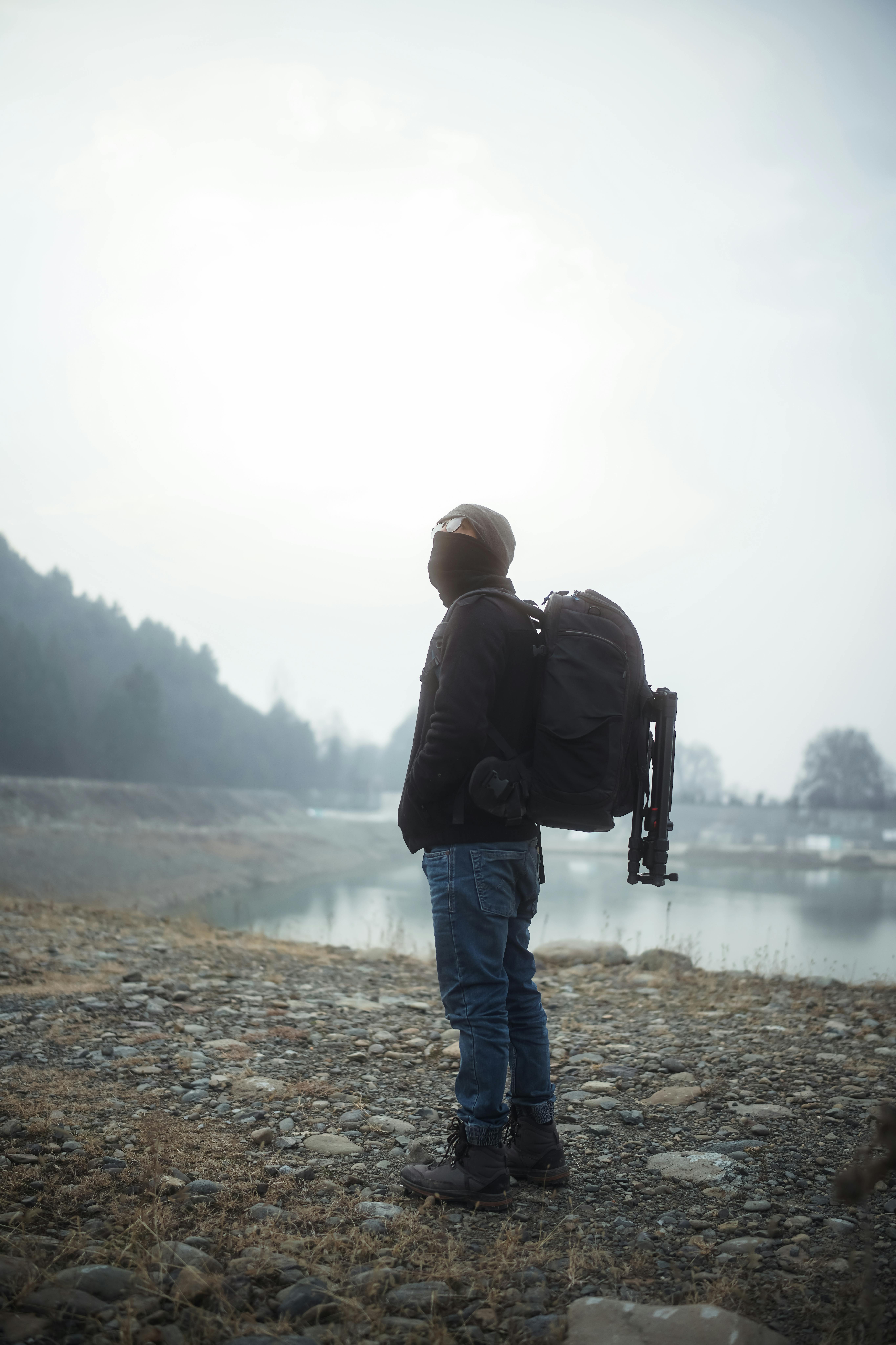 A Man Carrying a Bulky Backpack · Free Stock Photo