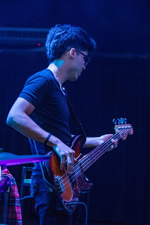 Man Playing Electric Guitar in Concert