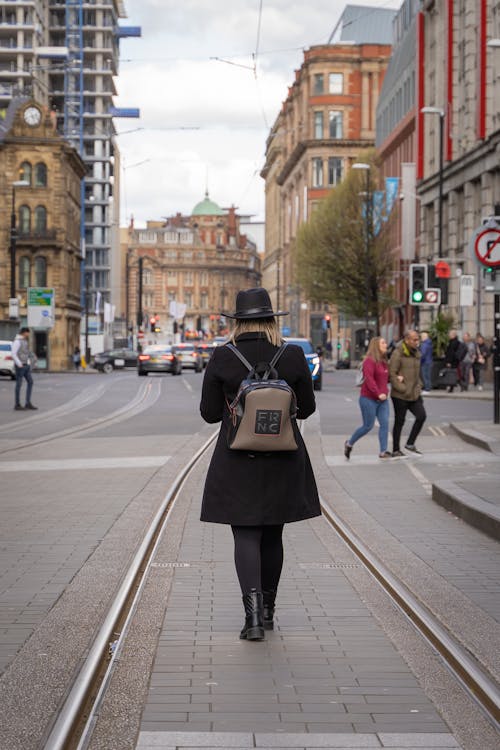 Woman Carrying a Backpack