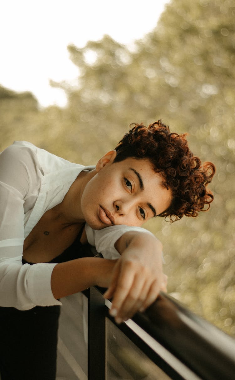 Woman Leaning On Guardrail