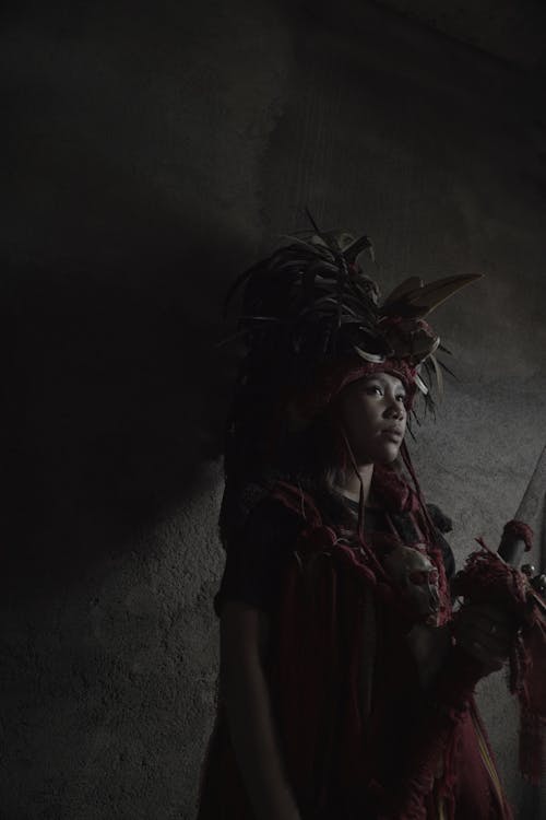 Dark Portrait of a Woman in a Ritual Costume