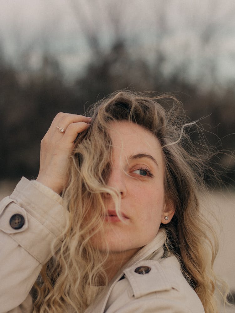 Woman With Her Hair Tangled By The Wind 