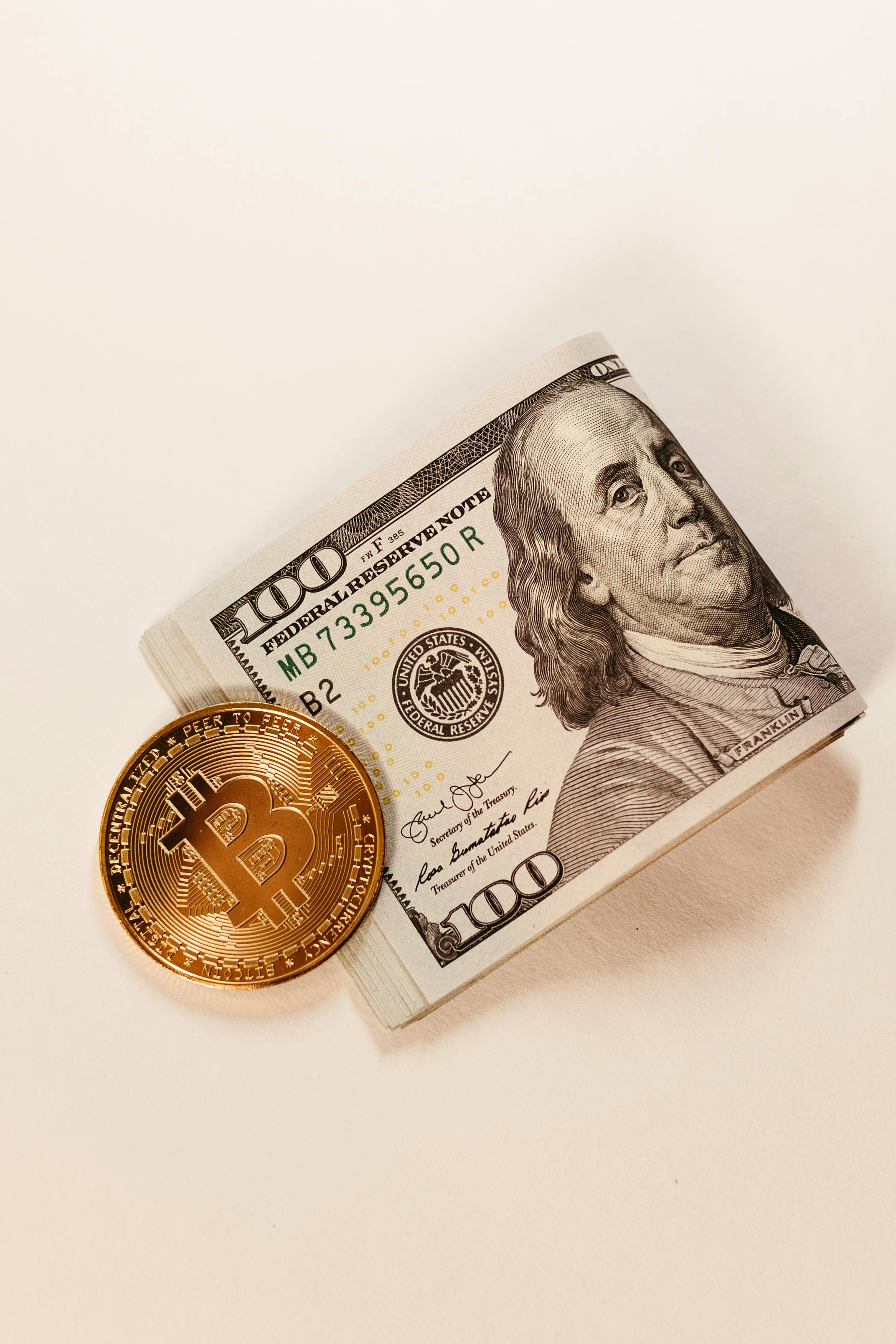 gold bitcoin coin and cash