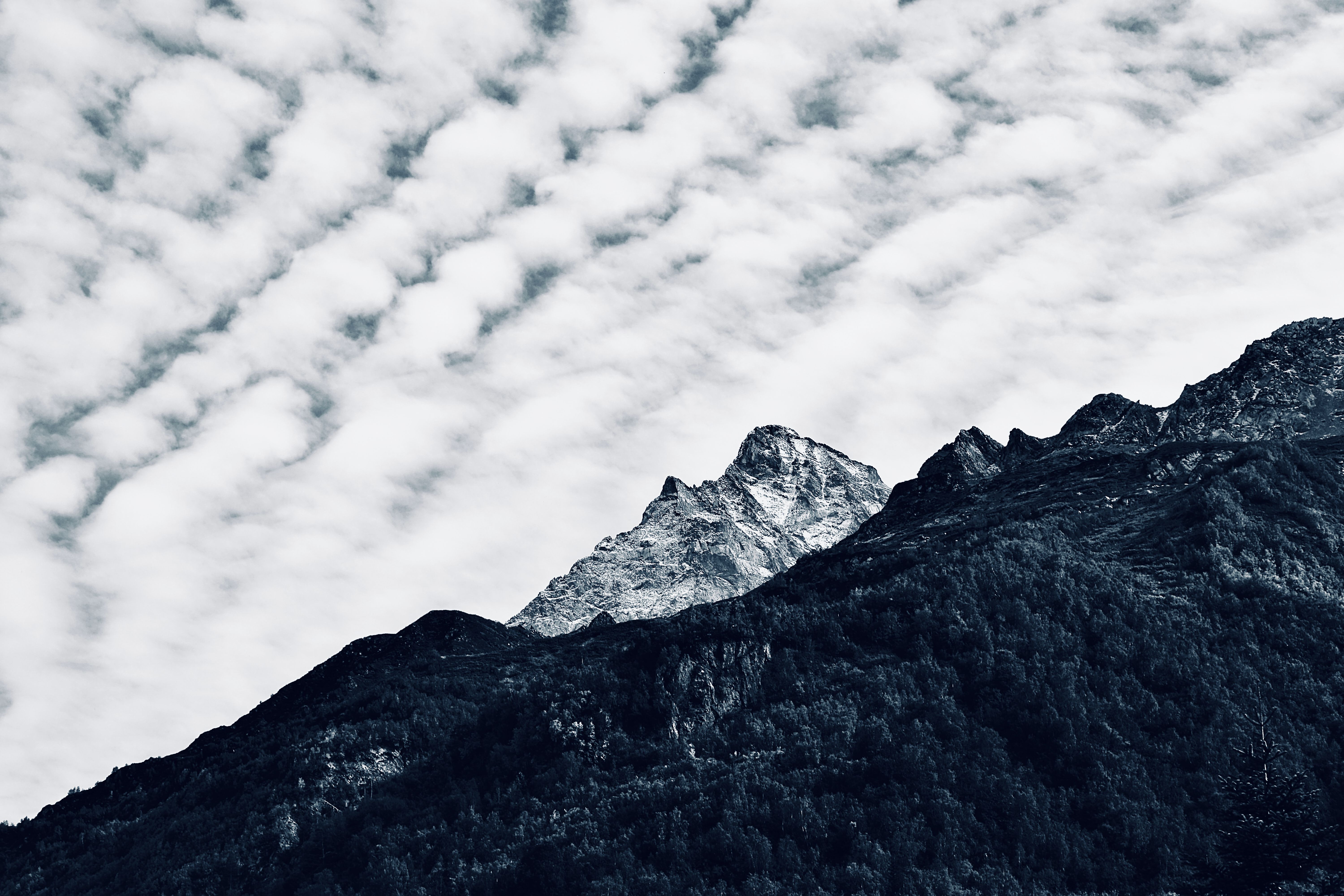 Fluffy White Clouds over Mountains in Snow · Free Stock Photo