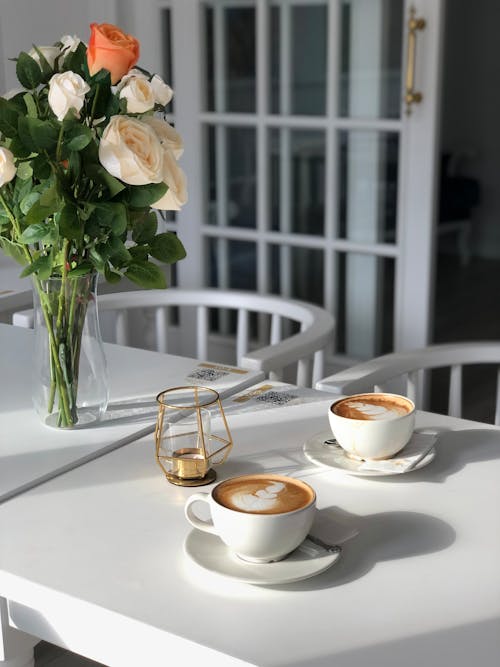 Cups with Coffee on Cafe Table