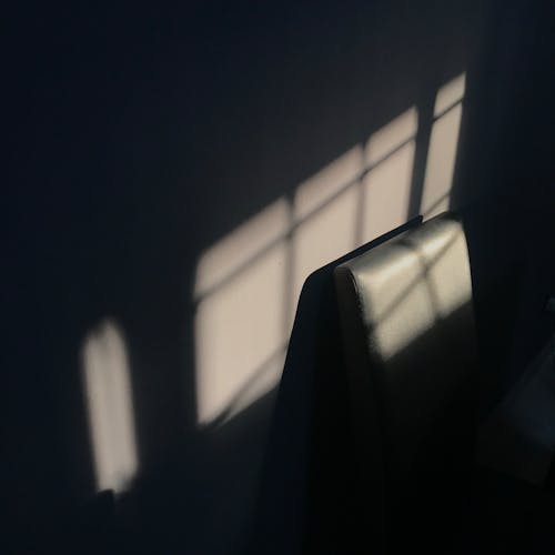 Photo of a Dark Room with Shadows on the Wall