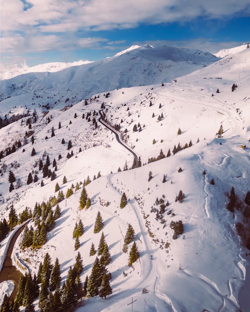 Aerial Shot of Mountains Covered in Snow