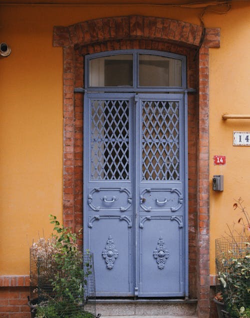 Purple Gate on Orange Wall