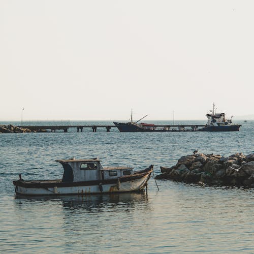 Fishing Boats Sailing near the Shore 
