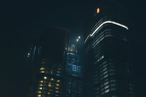 Low-Angle Shot of High Rise Buildings in the City during Nighttime