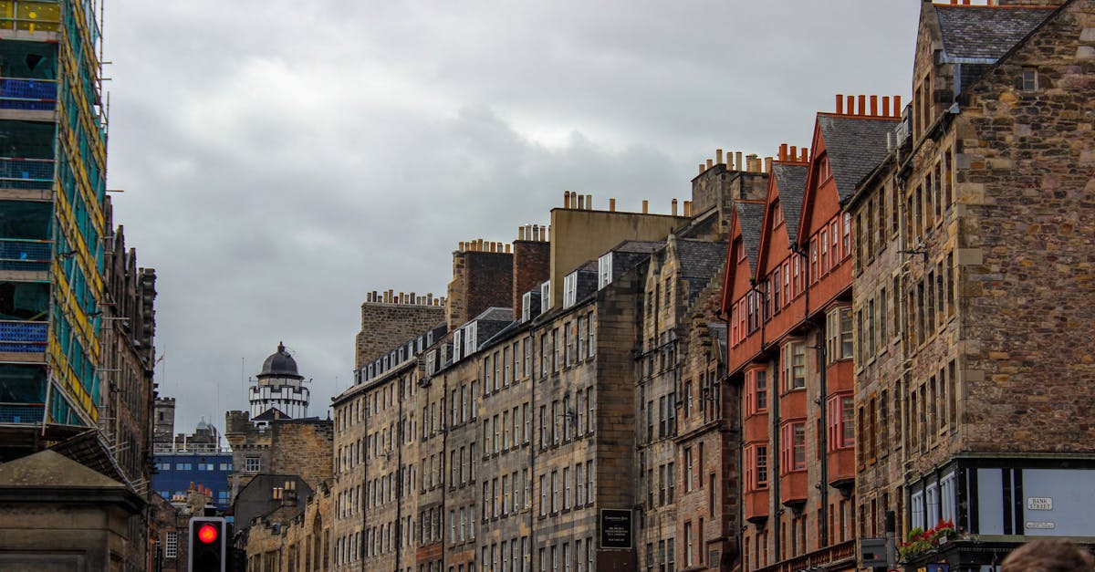 Explore the lively street scene in Edinburgh, showcasing historic buildings and vibrant city life.