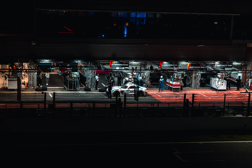 Free A high-performance race car makes a night pit stop at the Spa racing circuit in Belgium. Stock Photo