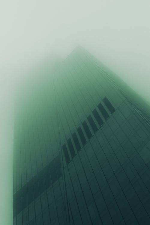 Low Angle Shot of a Skyscraper in Fog 