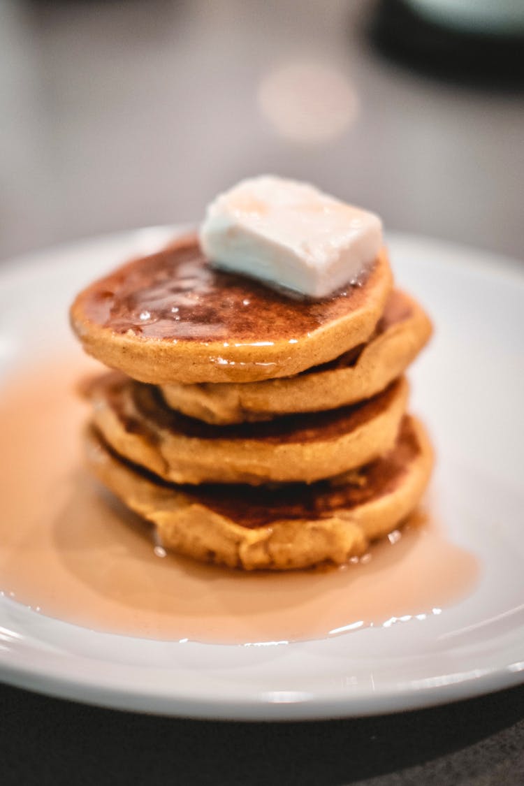 A Stack Of Pancakes On A Plate 