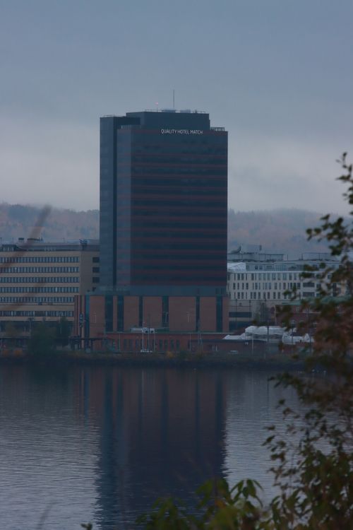 Free Captivating view of the Quality Hotel Match reflecting in a tranquil lake in Jönköping, Sweden. Stock Photo