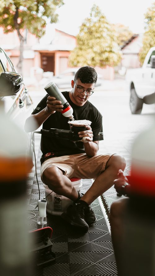 Man Putting Sticker Men Putting Stickers on a Car · Free Stock Photo