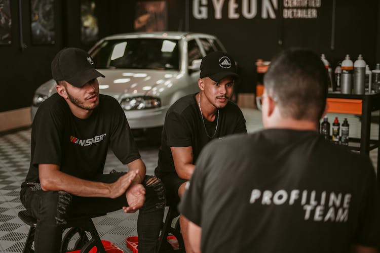 Men Working As A Team  In Auto Racing