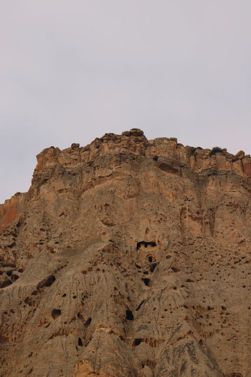 Free Stunning natural rocky cliff captured from a low angle perspective, highlighting its rugged texture. Stock Photo