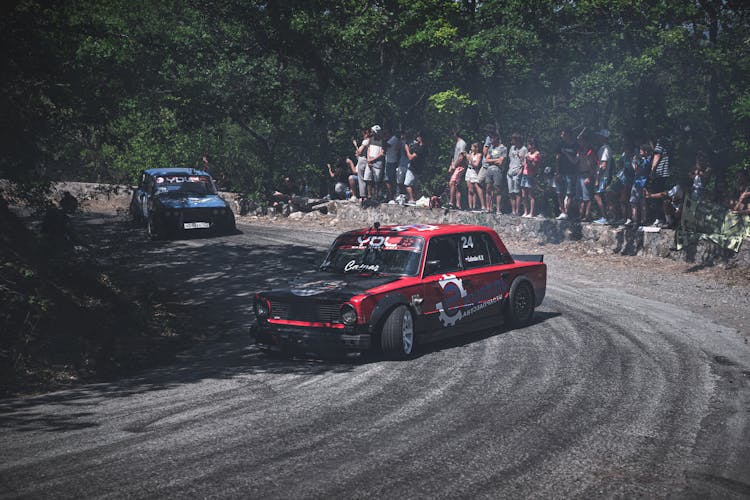 Cars Racing On Road In Forest