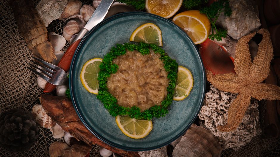 A hearty breakfast of Ful Medames with fresh bread on a table in Egypt.