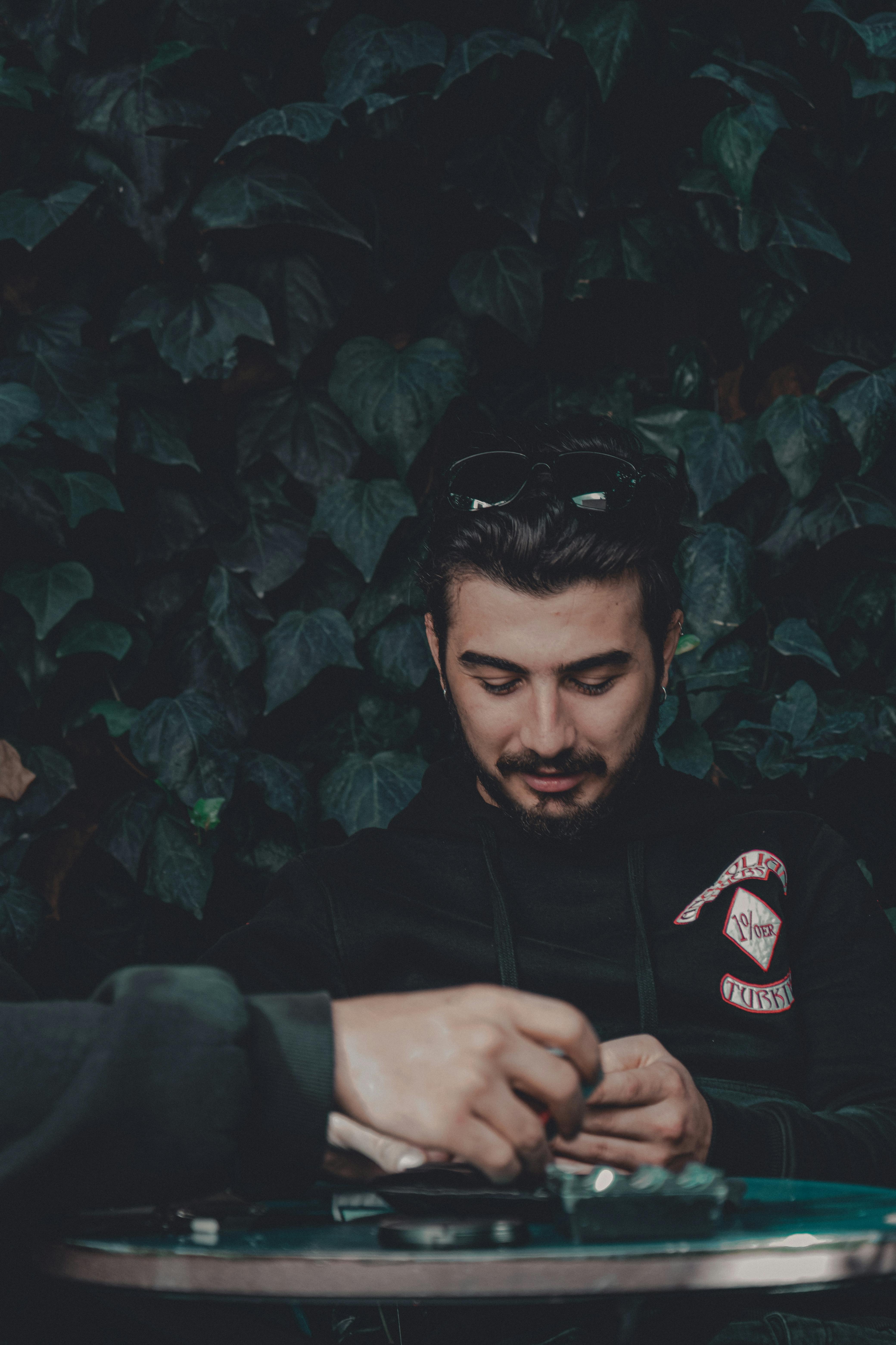 man-sitting-at-an-airport-lounge-free-stock-photo