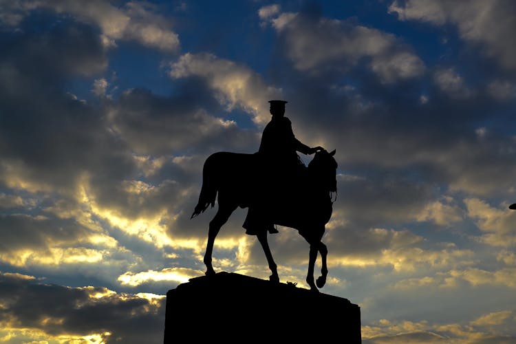 Silhouette Of An Equestrian Statue During Sunset