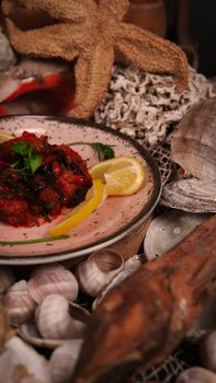 A beautifully plated Mediterranean dish with lemon and herbs, exuding vibrant flavors.