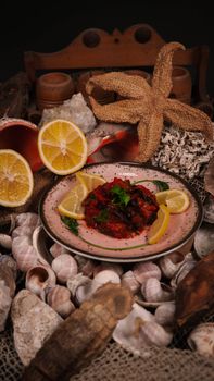 A flavorful seafood dish garnished with lemon slices, surrounded by seashells and maritime decor.